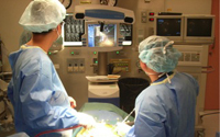Spine surgery proceeding in surgical room